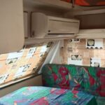 1995 Gypsey Regal — interior lounge with air conditioner